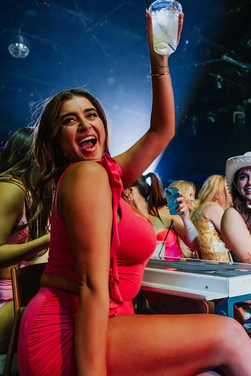 Is It Cheaper to Book a Vegas Package vs Individually? 1 Girl Cheering With Glass